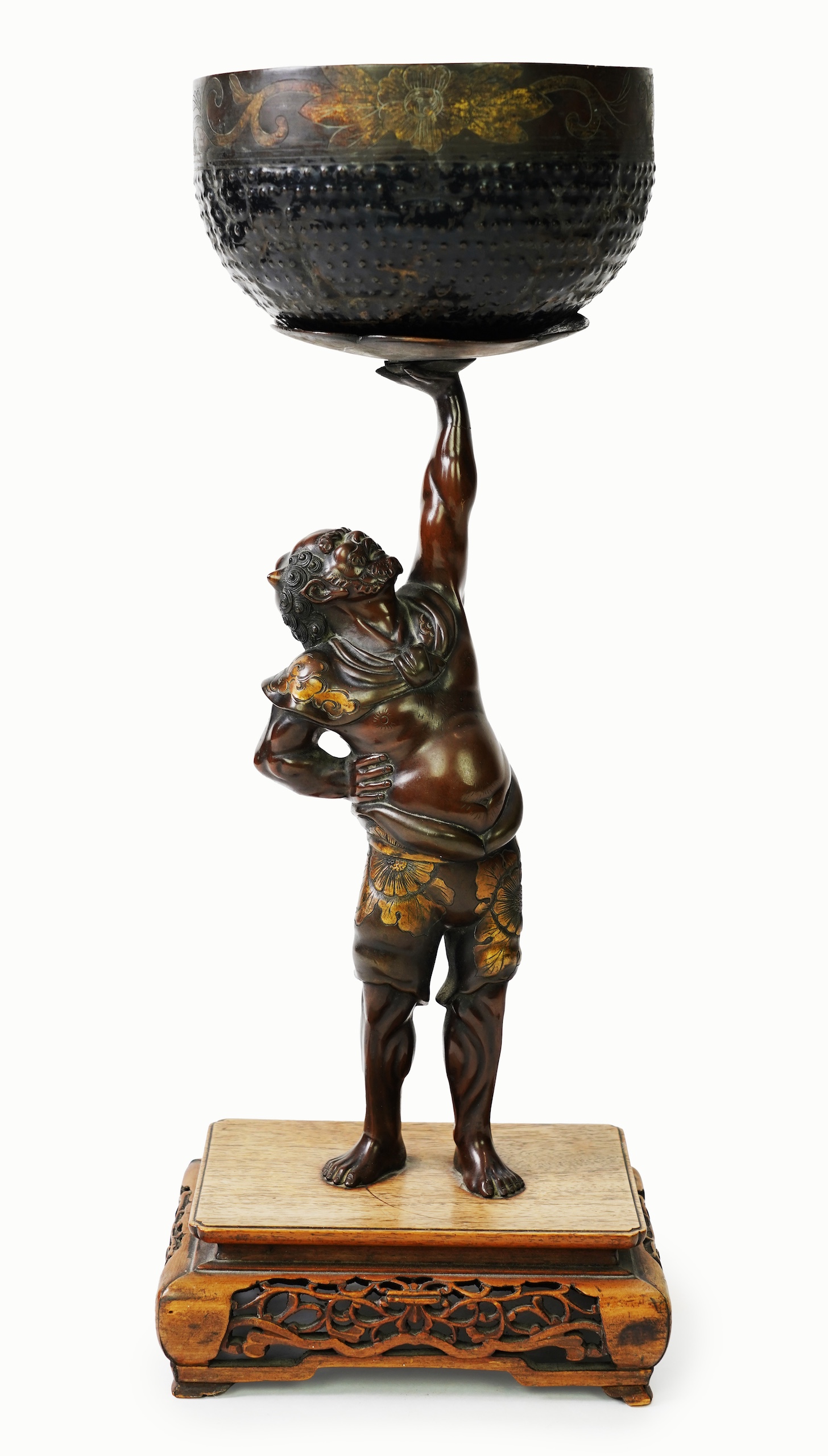 A Japanese bronze figure of an Oni holding a temple bell aloft, Meiji period, in Miyao style